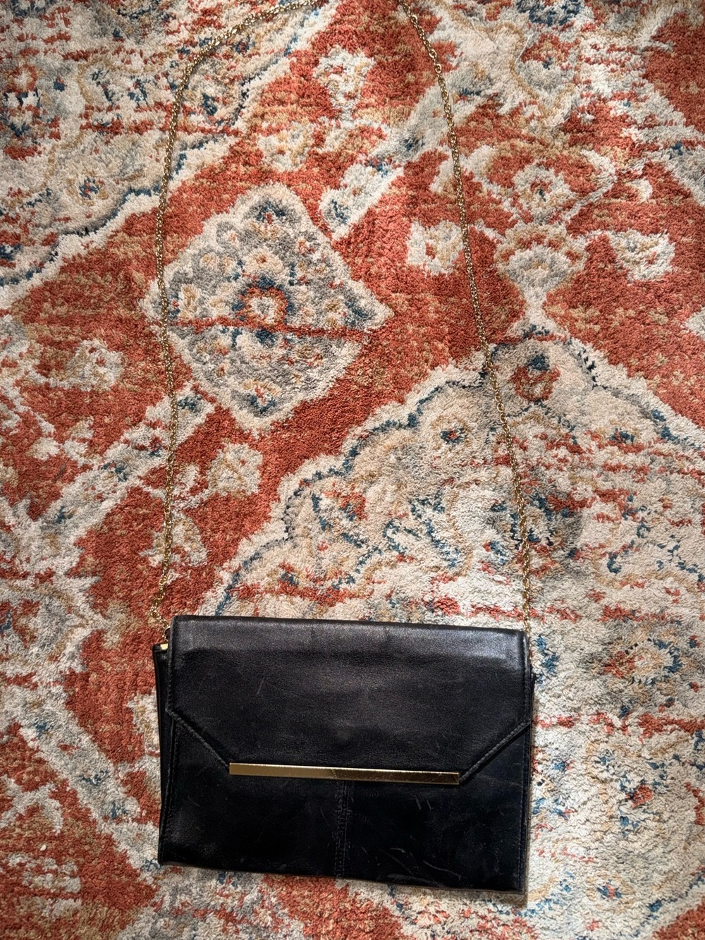 Classic Black Leather Envelope Crossbody Bag with Gold Accent
